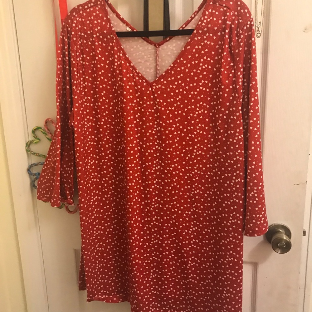 Red tunic with heart pattern